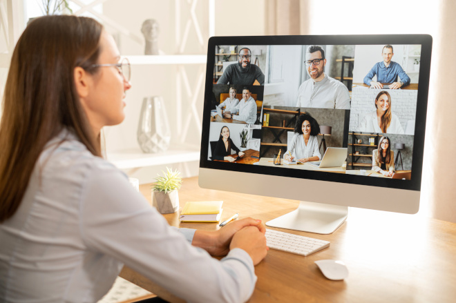 female employee video conference call monitor